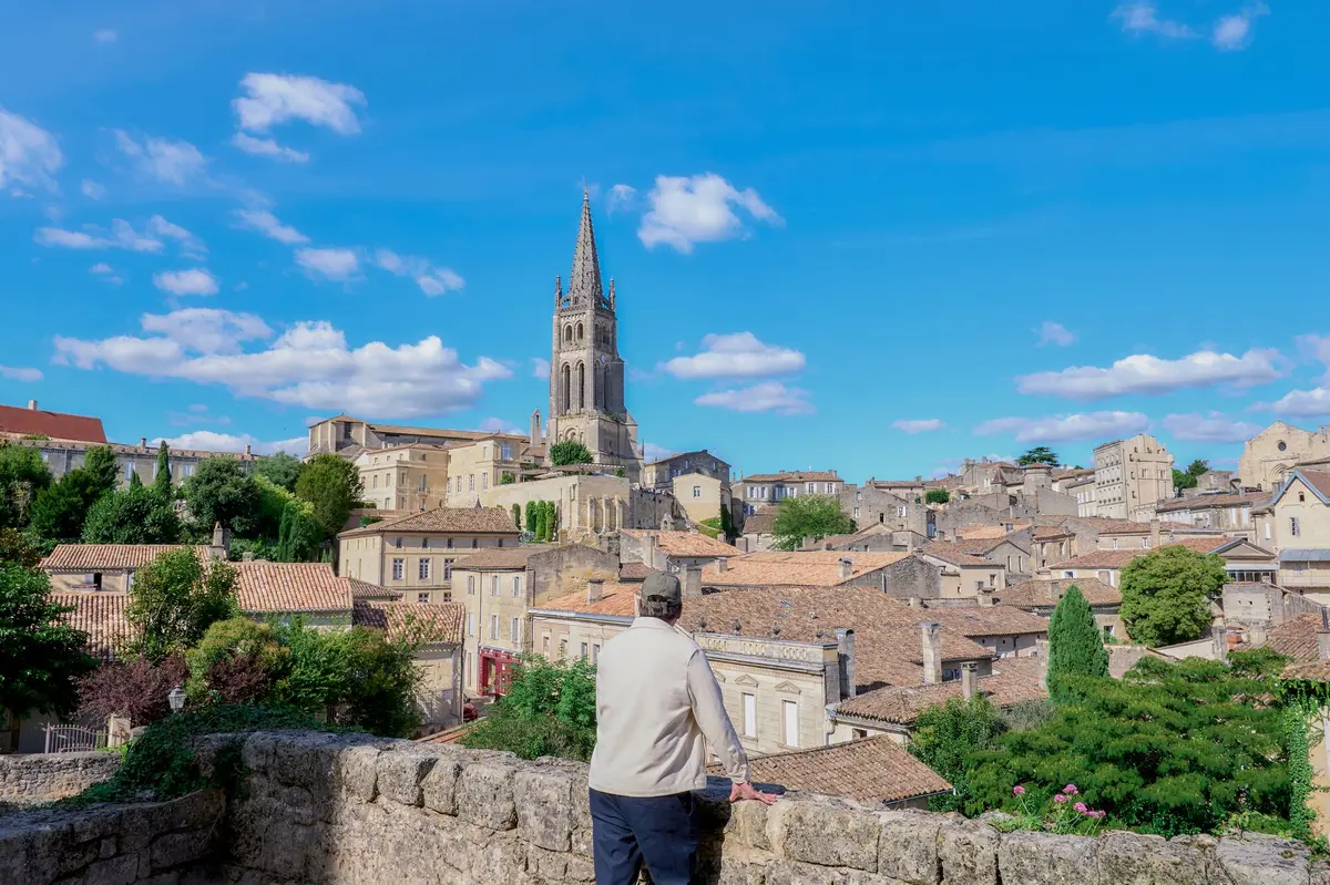 Traveler overlooking a historic town during an AmaWaterways land extension.